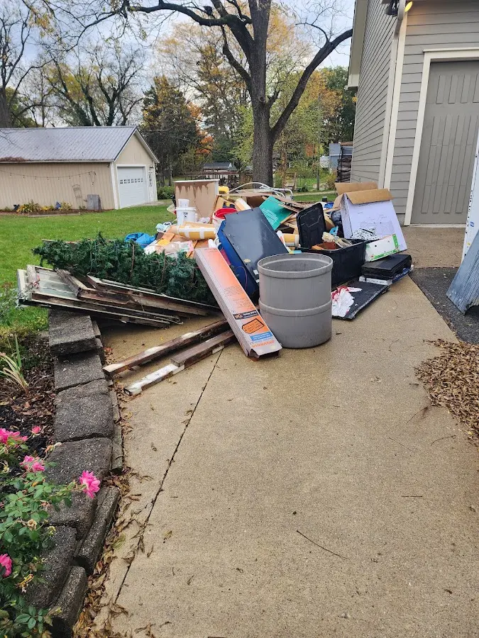 Dumpster being loaded with debris for Commercial Dumpster Rental in Scottsville